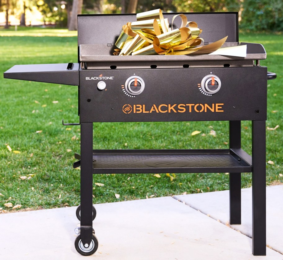 Blackstone griddle with a gold bow on top