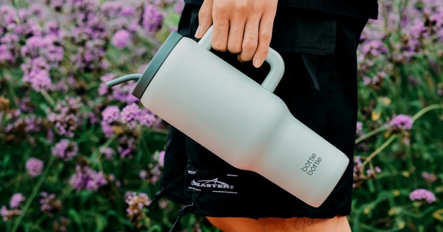 person holding bottle bottle 40oz tumbler in green