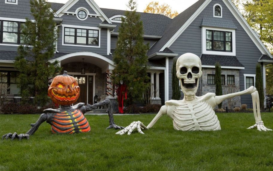 a pumpkin and skeleton ground breaker halloween yard decos. 