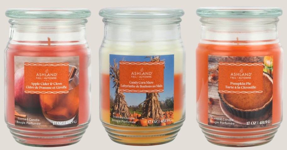 3 glass jar candles with lids in various fall scents and colors