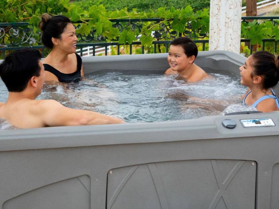 Two Adults and Two Kids in a Lifesmart 5-Person Spa