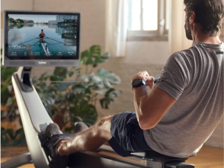 Man using a Hydrow rowing machine