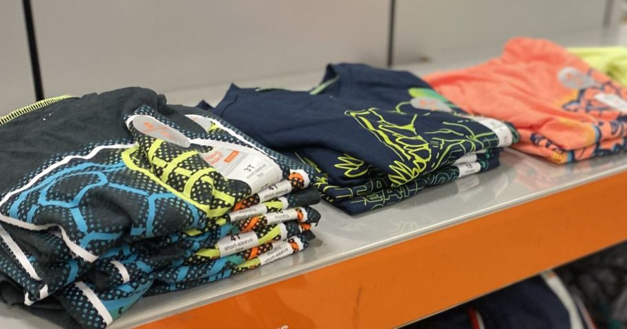 Stacks of folded boys jumping beans graphic tees at Kohl's