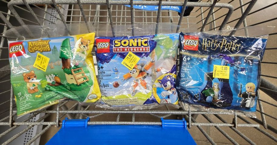 three lego mini bags in cart in store