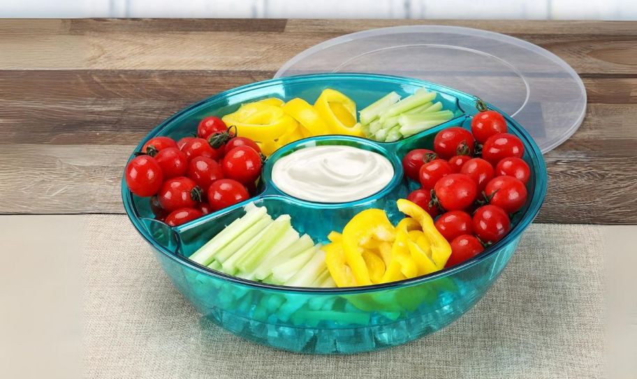 a blue acrylic appetizer on ice serving tray on a kitchen counter