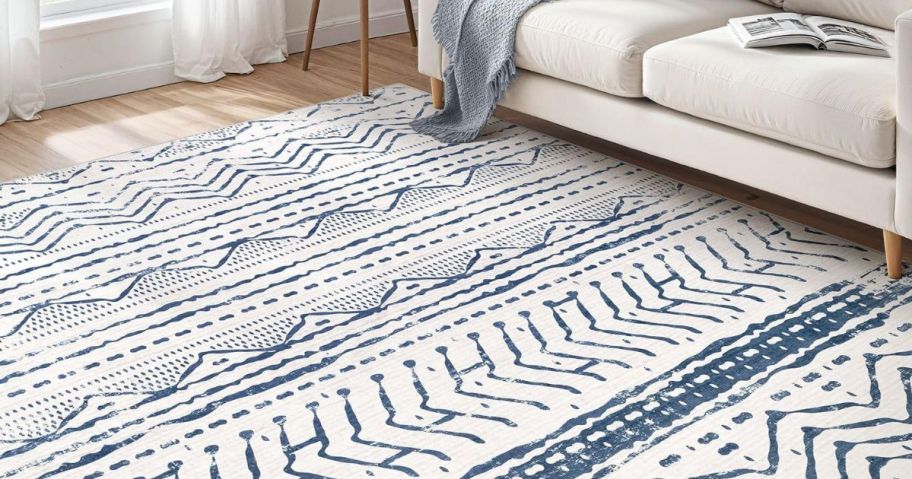 A Nakagishi Washable Rug in blue and white in a living room