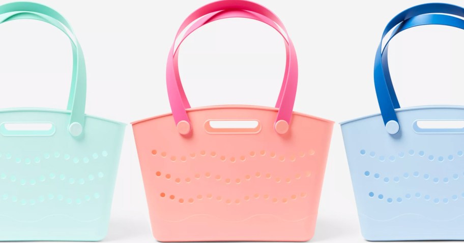 teal, pink, and blue tote bags