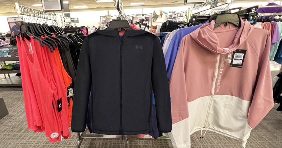 under armour jackets on store display racks