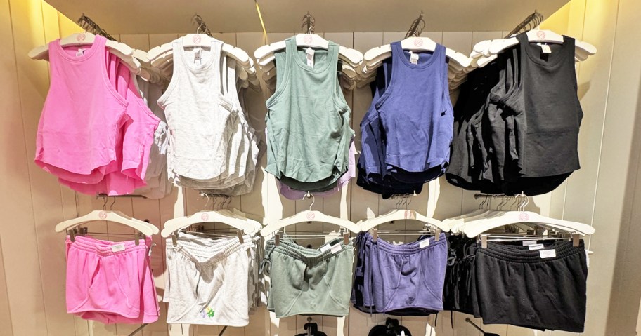 store wall display of matching tank tops and shorts in various colors