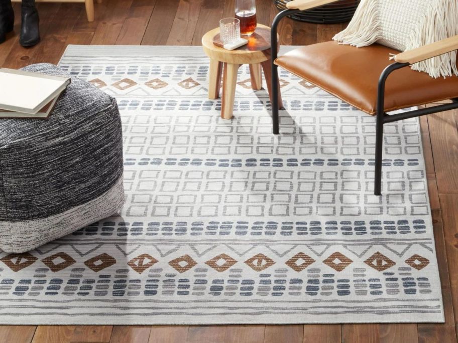 Wanda June Home Geo Washable Area Rug in living room