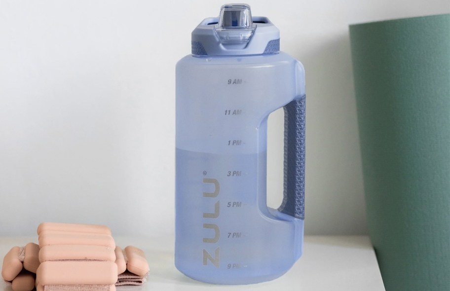 purple water jug with time markers along the side