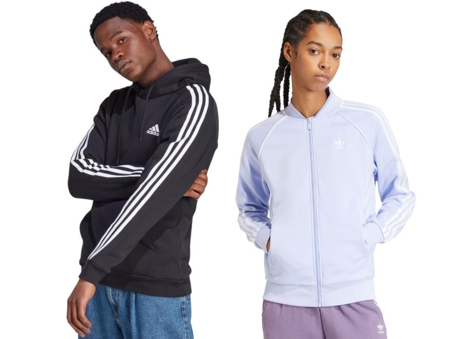 A man and a woman wearing adidas sweatshirts