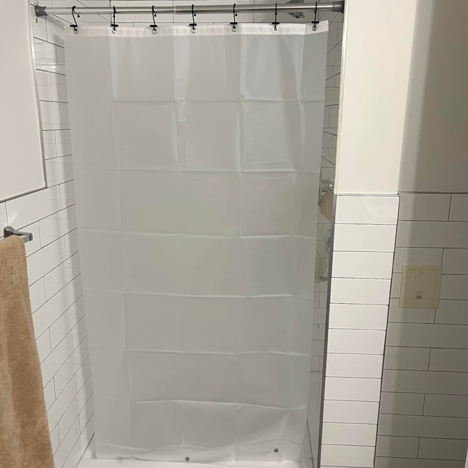 shower curtain liner in tiled shower stall