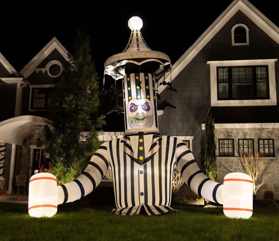 scary animatronic beetlegeuse ground breaker in front of a house