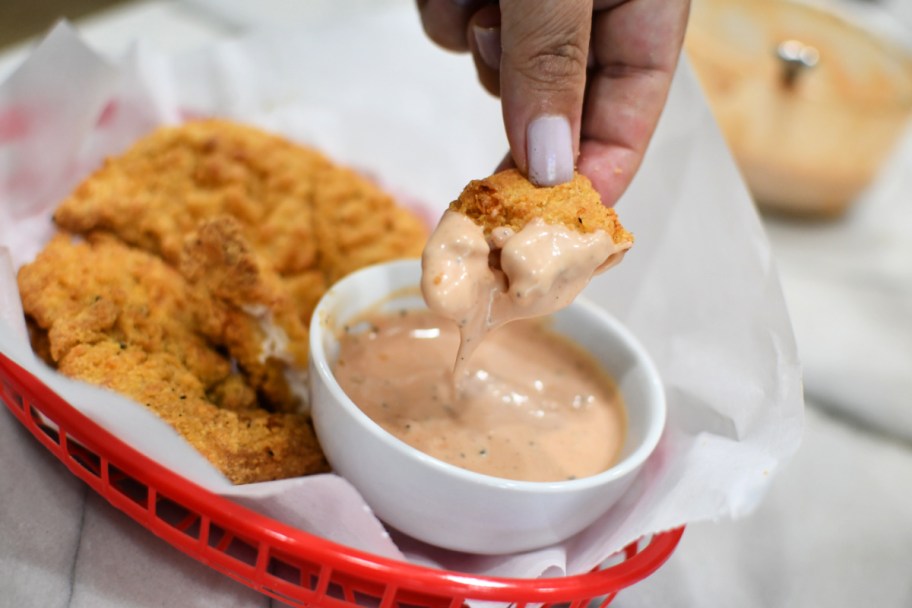 chicken tenders dipped in sauce