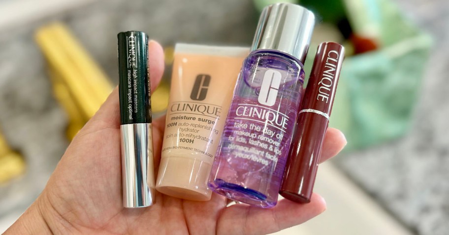 hand holding clinique beauty products