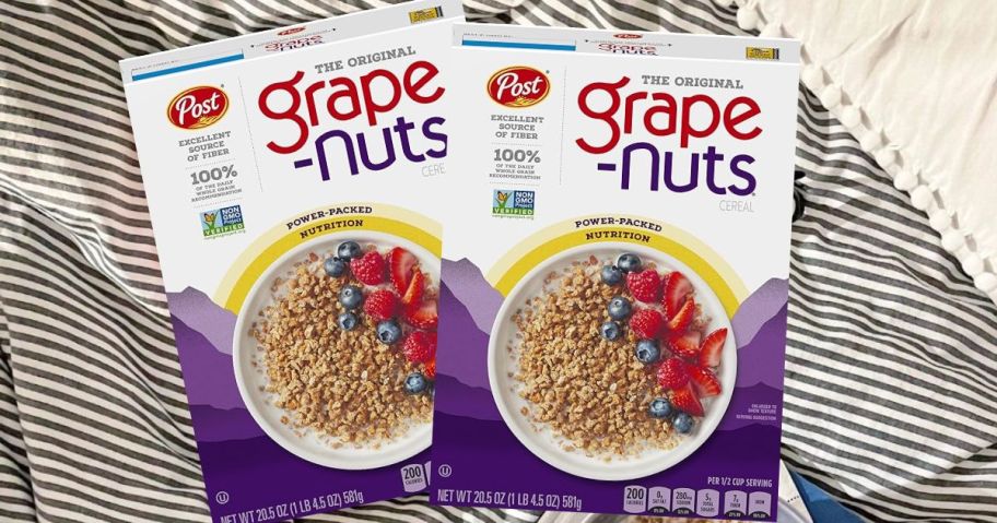 two boxes of grape nuts cereal laying on a blanket