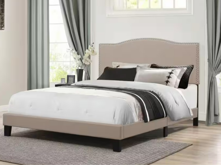 tan platform bed frame with mattress and onlineforter, pillows in a bedroom