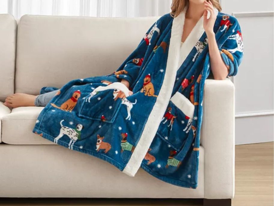 woman wearing Charter Club Cozy Plush Wrap Throw laying on the couch