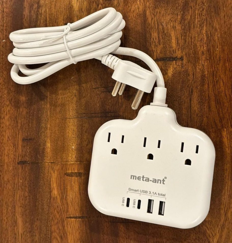 travel power strip on wood surface