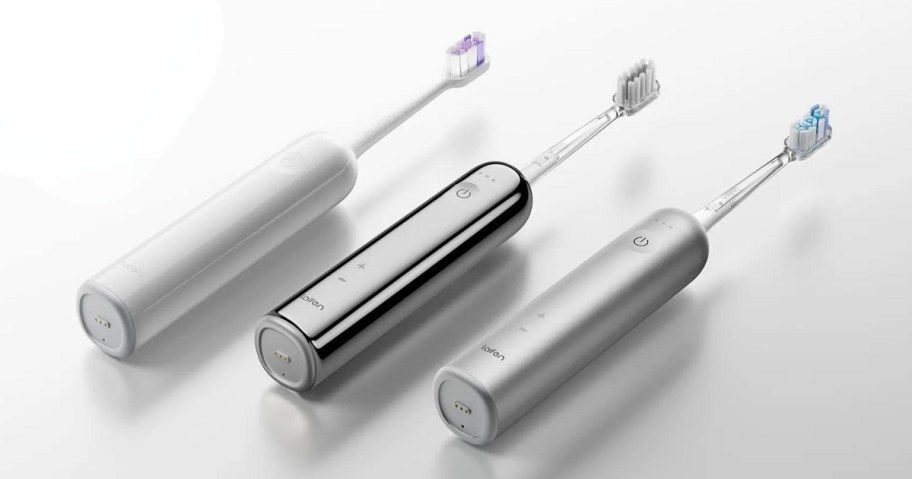 white, stainless steel, and aluminum silver Laifen Electric Toothbrushes laying on a white background