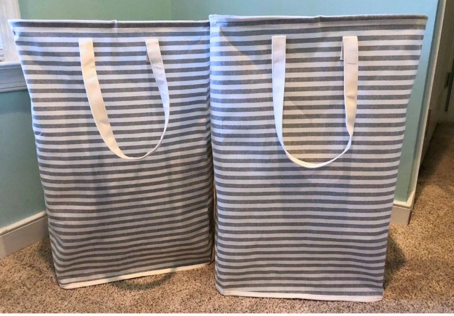 two lifewit gray and white striped collapsible laundry hampers in a room