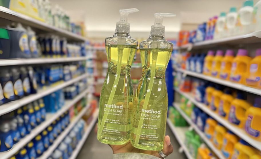 hand holding 2 bottles of lime and sea salt Method Dish Soap in a store aisle