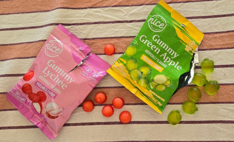 a bag of nice lychee peelable candy shown with a bag of green apple peelable candy