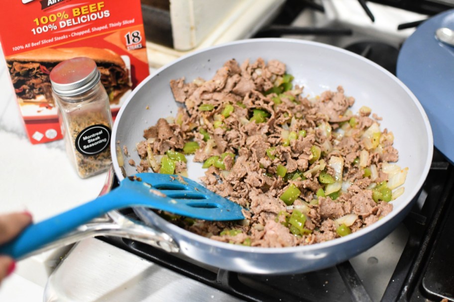 Steak-umm Sliced Steak in a skillet with onions and peppers 