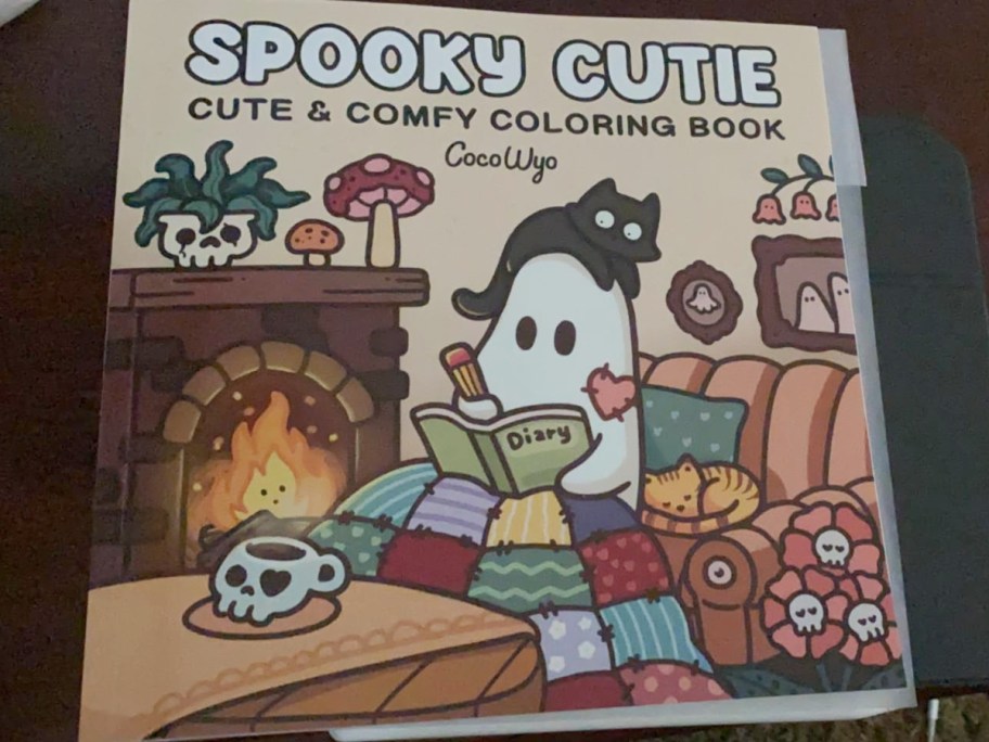 adult coloring book with ghost on the cover