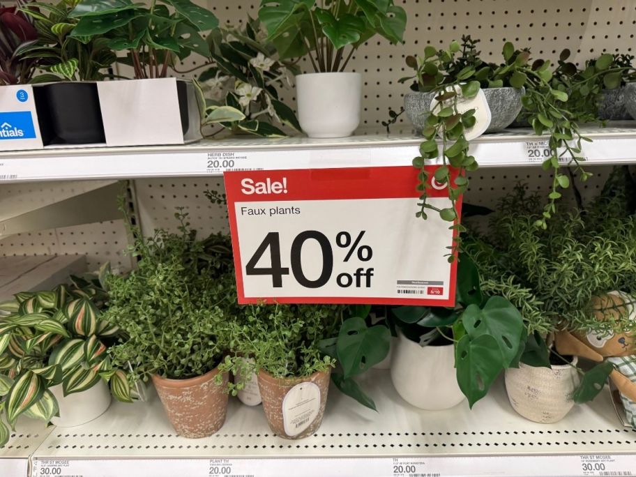 a selection of artificial houseplants on a store shelf