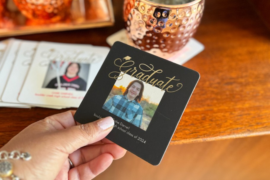 hand holding black photo coaster