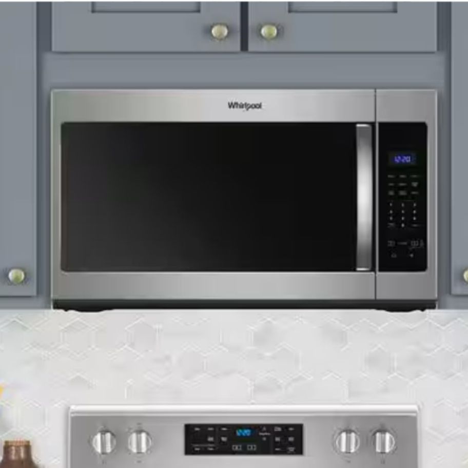 a stainless steel over the range microwave in a kitchen