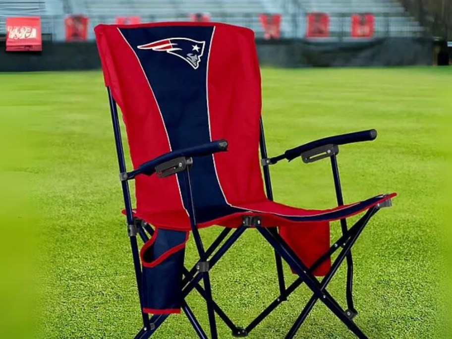 New England Patriots red and blue camping chair on a field