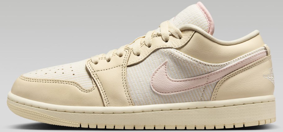 tan, white, and light pink nike sneaker