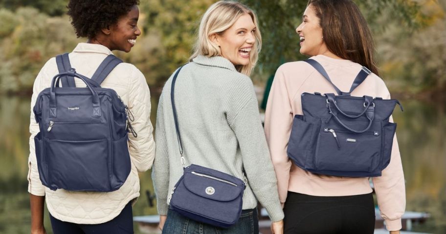 3 women wearing Baggallini bags in french navy color