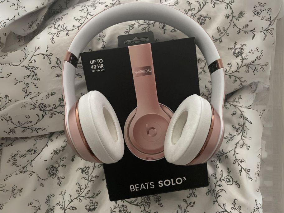 Beats Solo3 Wireless On-Ear Headphones in Rose Gold on bed