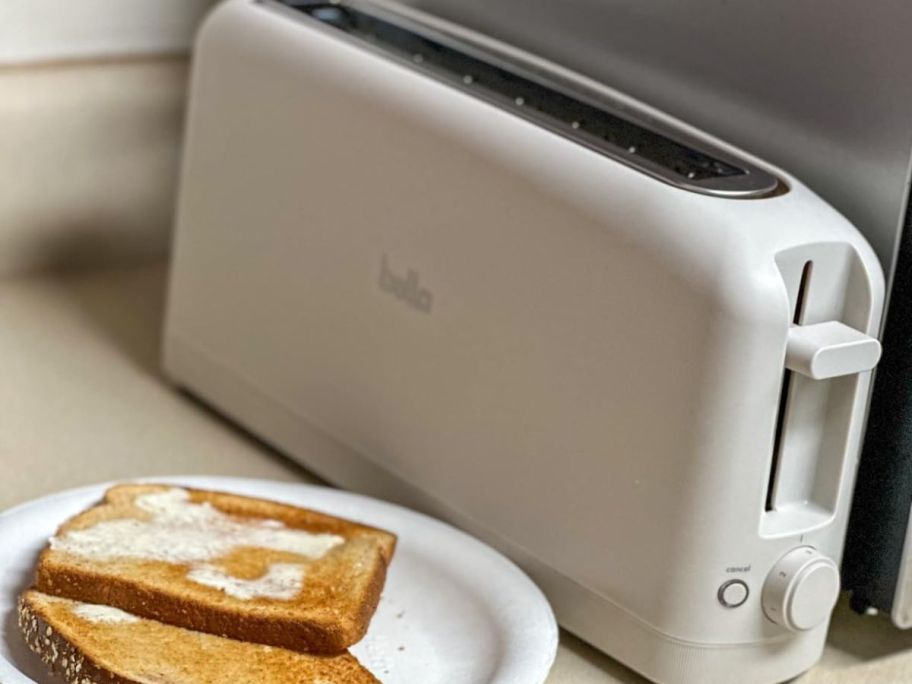 A slim toaster on a counter