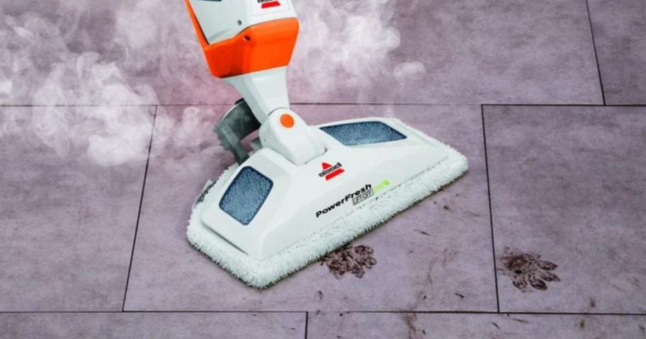 Bissell PowerFresh Pet Lift-Off 2-in-1 Scrubbing & Sanitizing Mop cleaning up paw prints in the floor