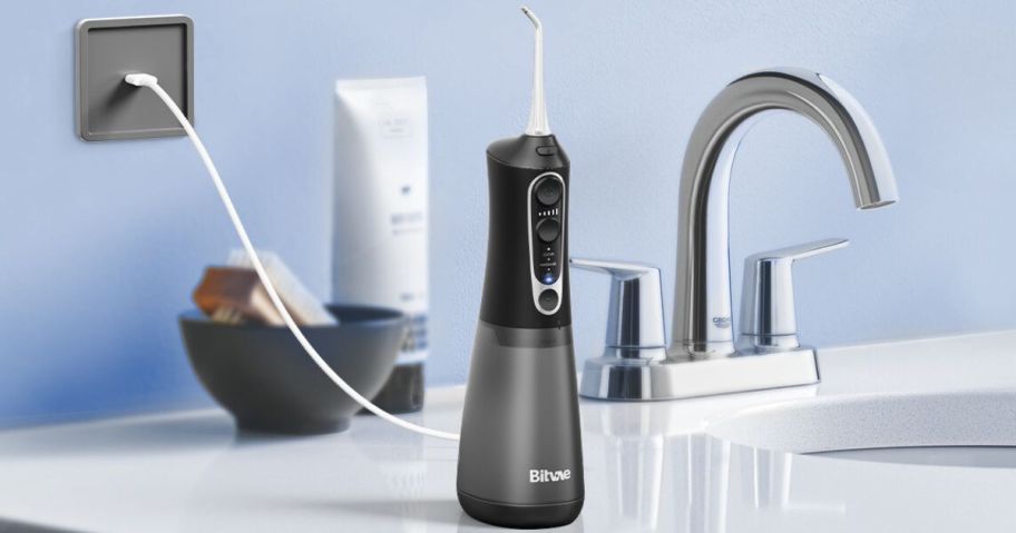 Bitvae Water Flosser in Black on bathroom counter