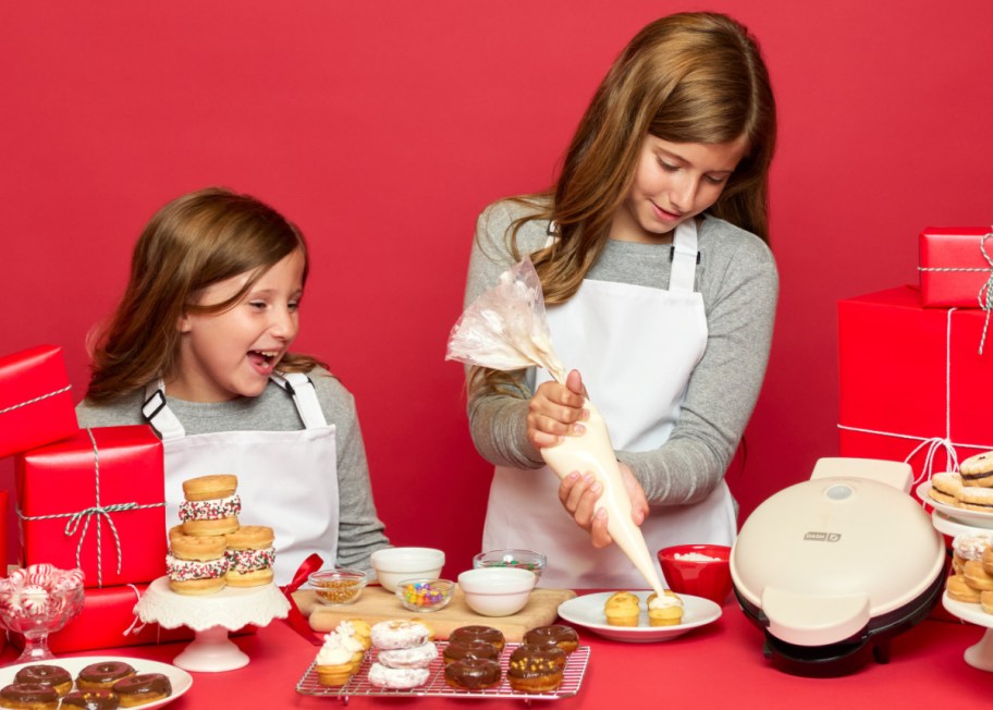 Girls using dash makers to create holiday treats for 2024