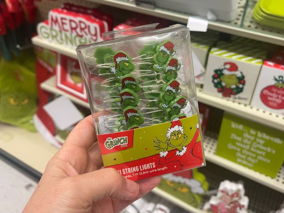 Grinch Mini String Lights being held by hand in store