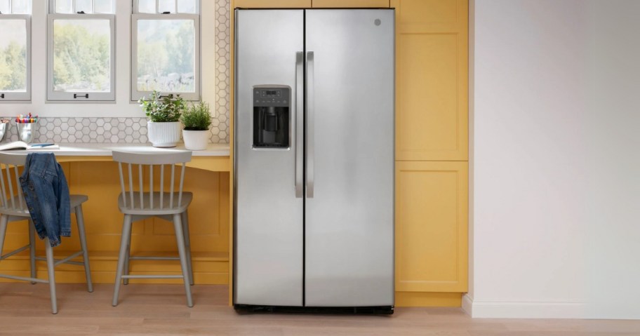 a stainless steel side by side fridge in a kitchen