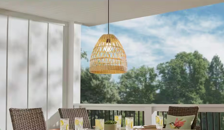 wicker pendant light hanging from patio ceiling