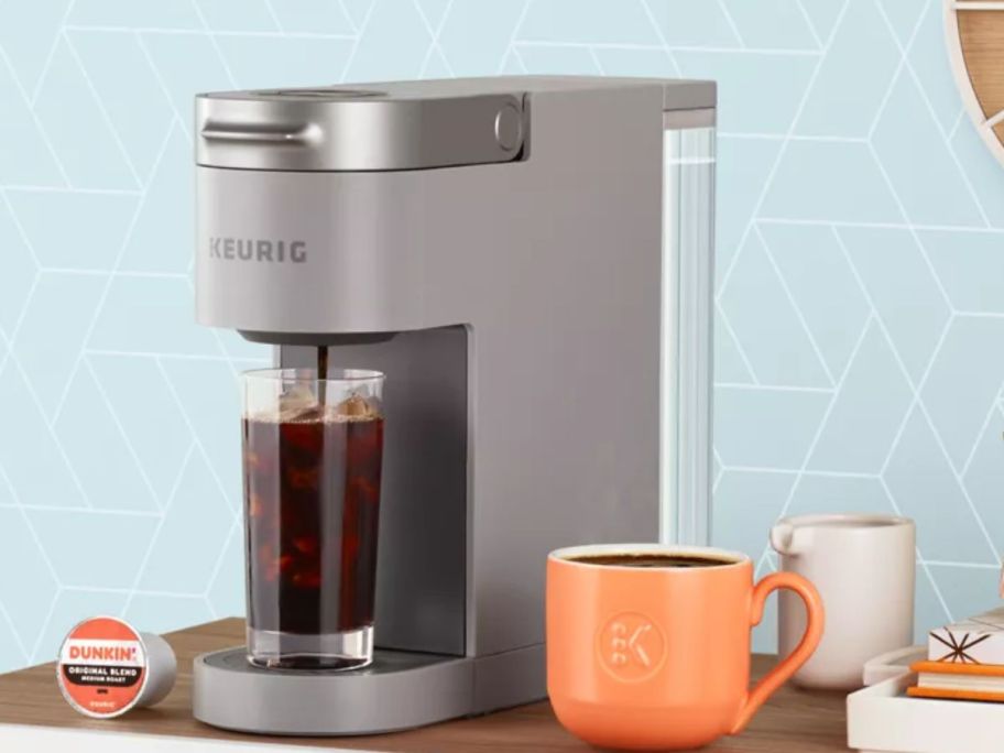 Keurig K-Slim Coffee Maker brewing iced coffee on a counter