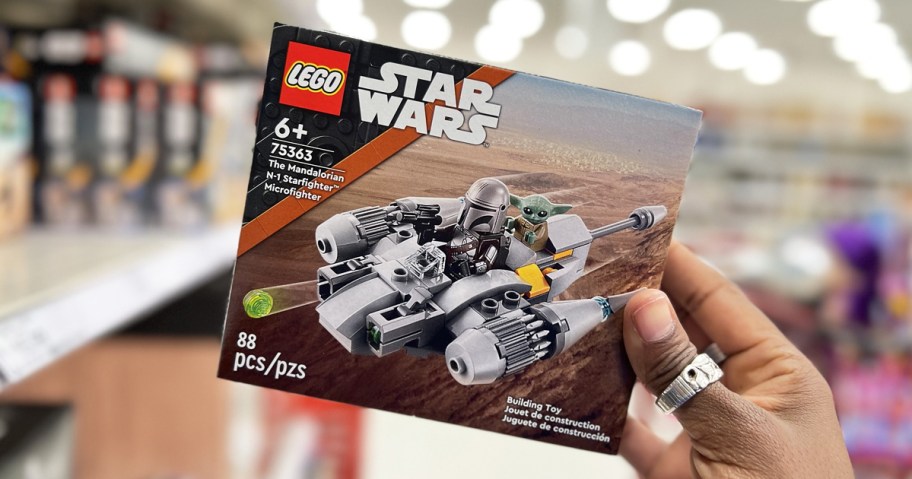 hand holding up box to lego star wars set in store