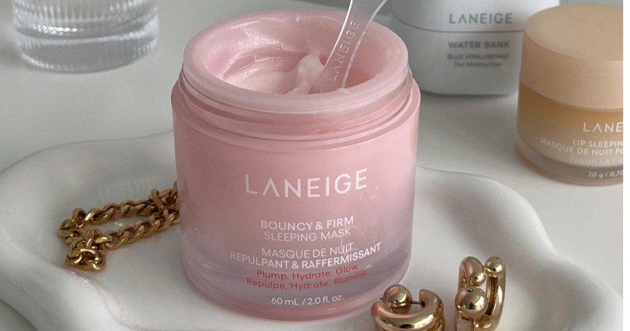 open pink jar of laneige sleep mask on bathroom counter