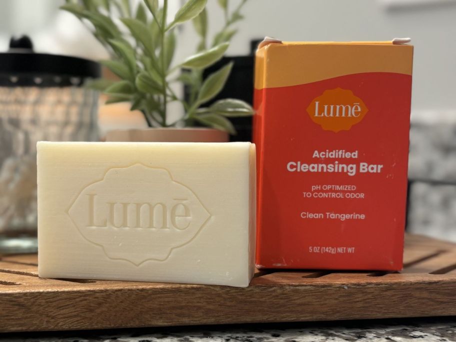 A Lume bar soap next to the box it onlinees in