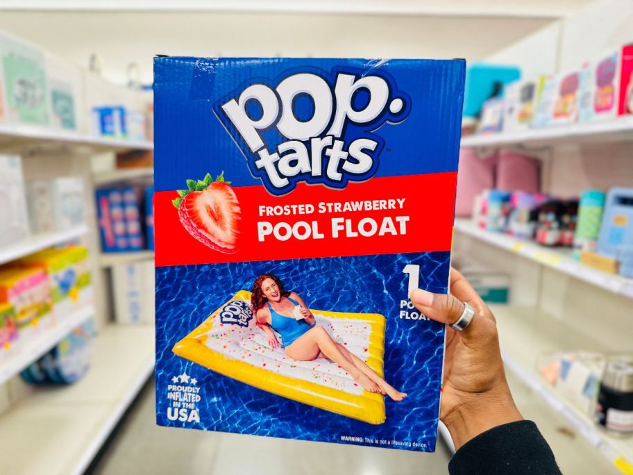 A person holding Pop Tarts Pool Float box