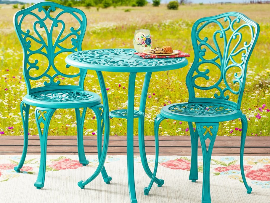 teal patio bistro set with 2 chairs and matching table